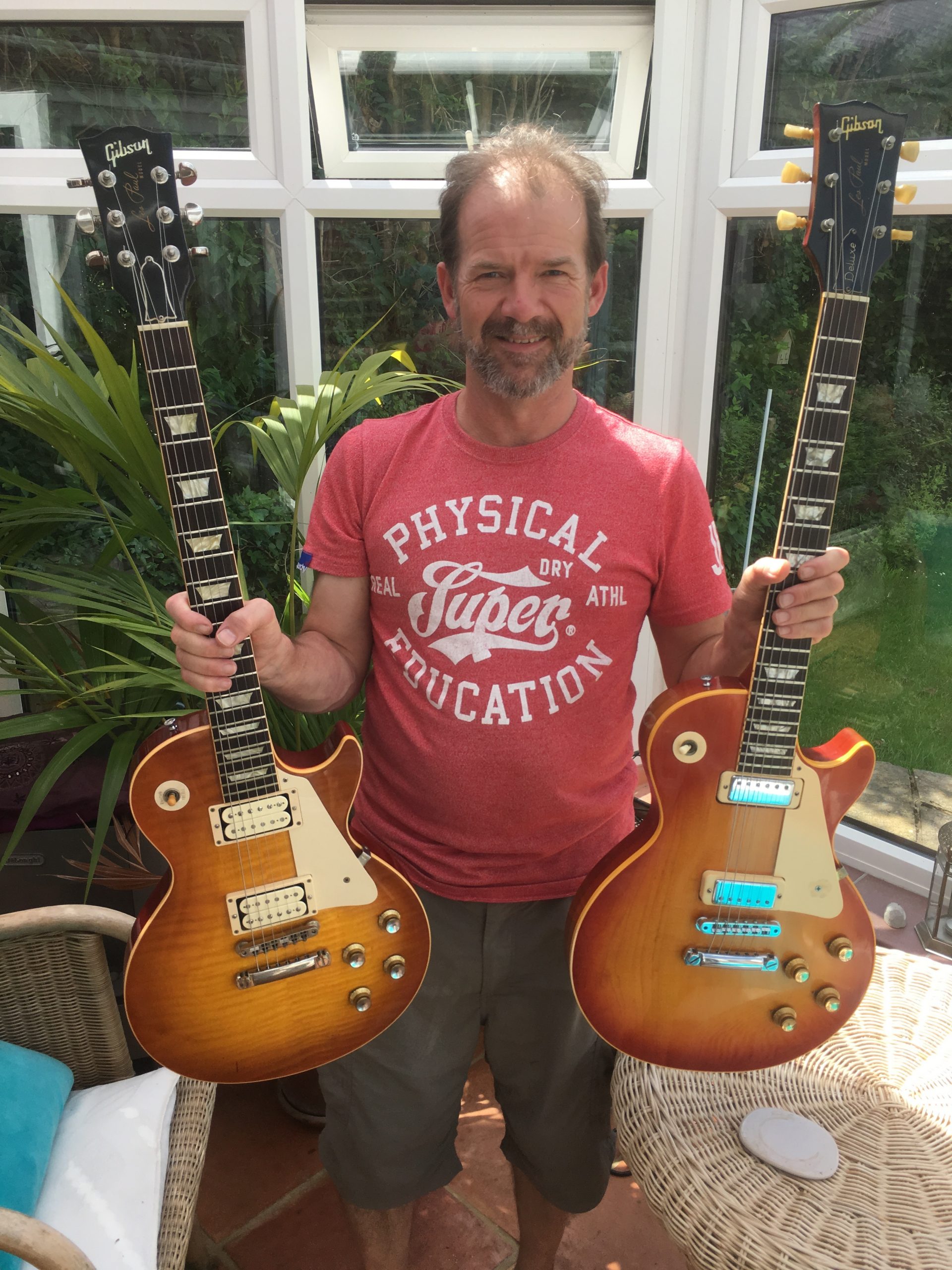 neil-rigby-two-gibson-les-pauls Neil Rigby with two Gibson Les Pauls